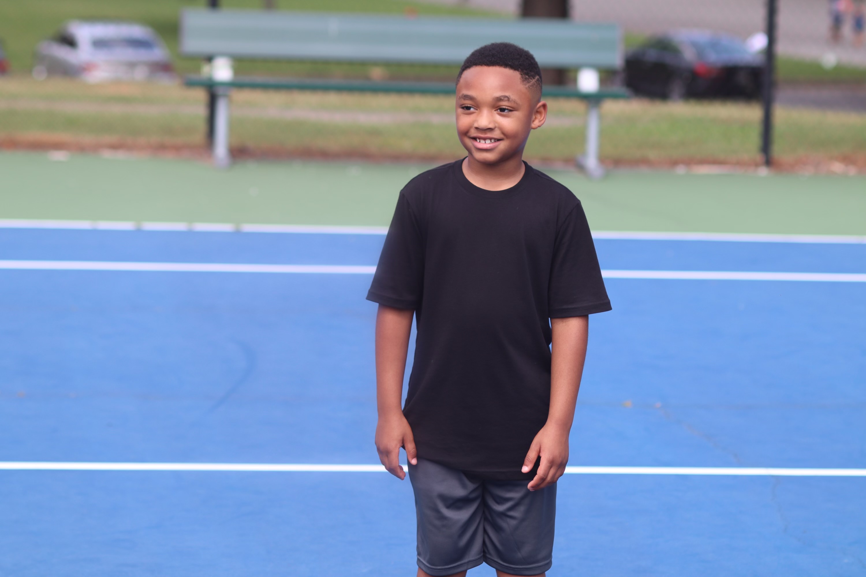 Youth at ELW tennis camp on the court